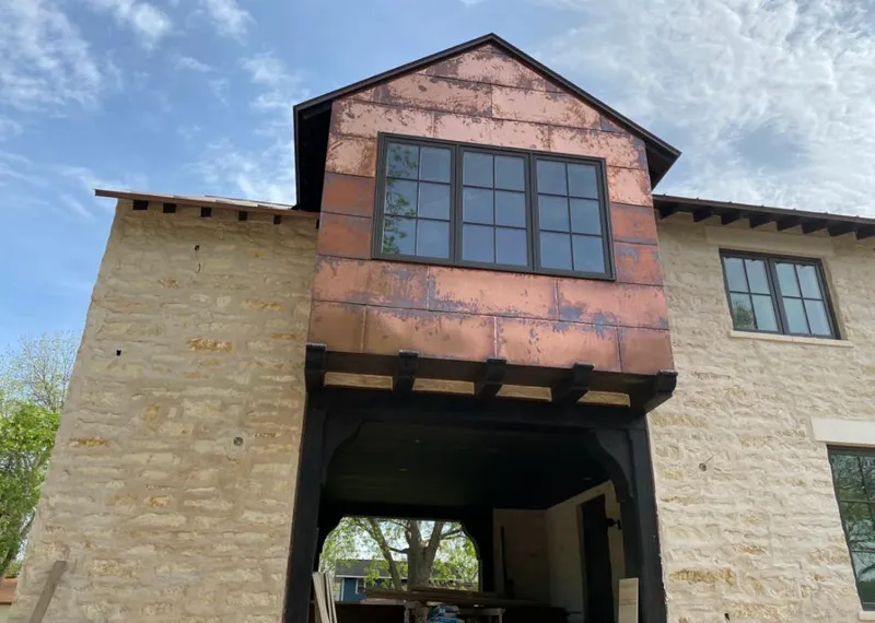 Copper metal panel facade on a stone building for Skylight Installation in Dunn Loring